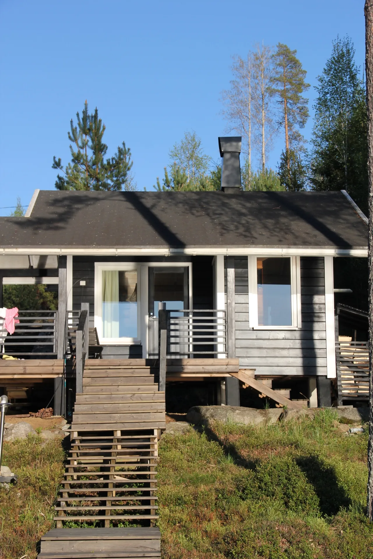 Lakeside cottage exterior with deck and stairs