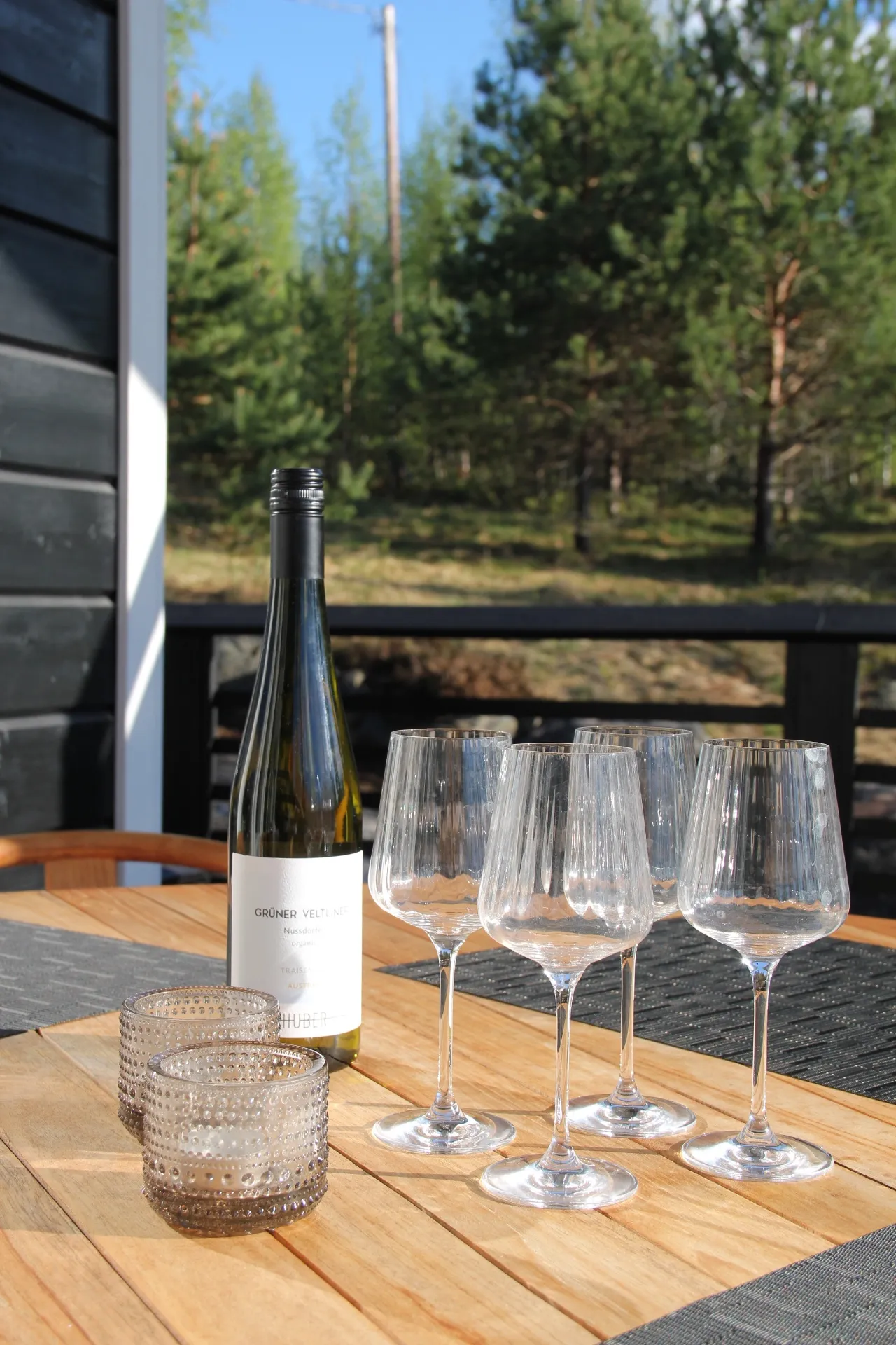 Wine and glasses on the outdoor table