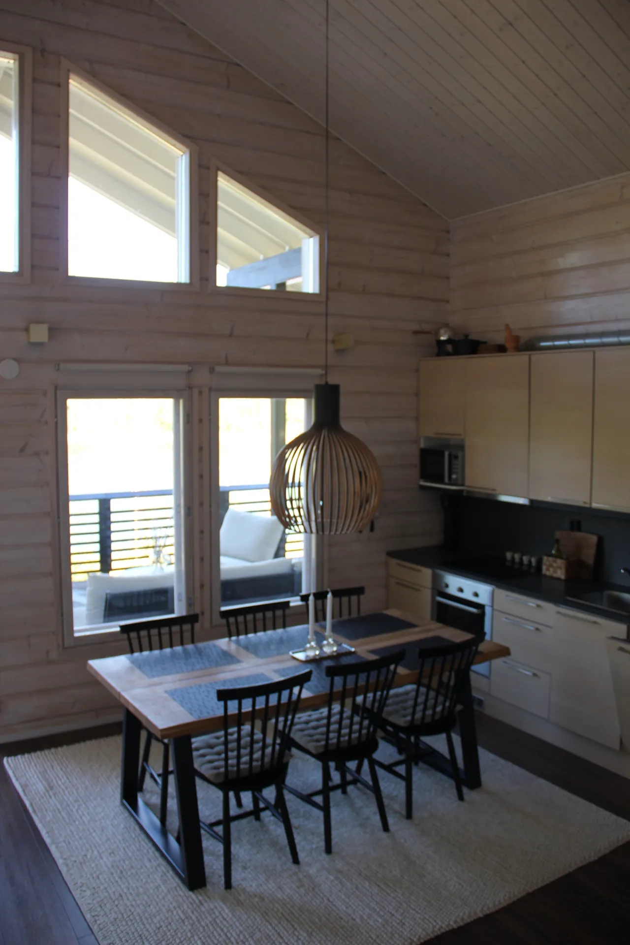 Dining table and kitchen with pendant light