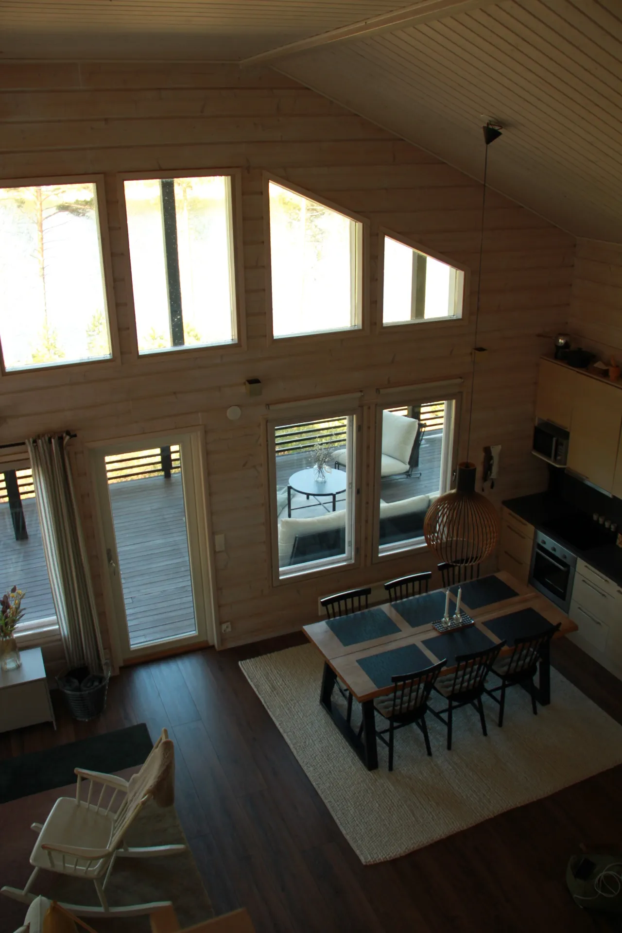 View from the mezzanine over the dining table and kitchen
