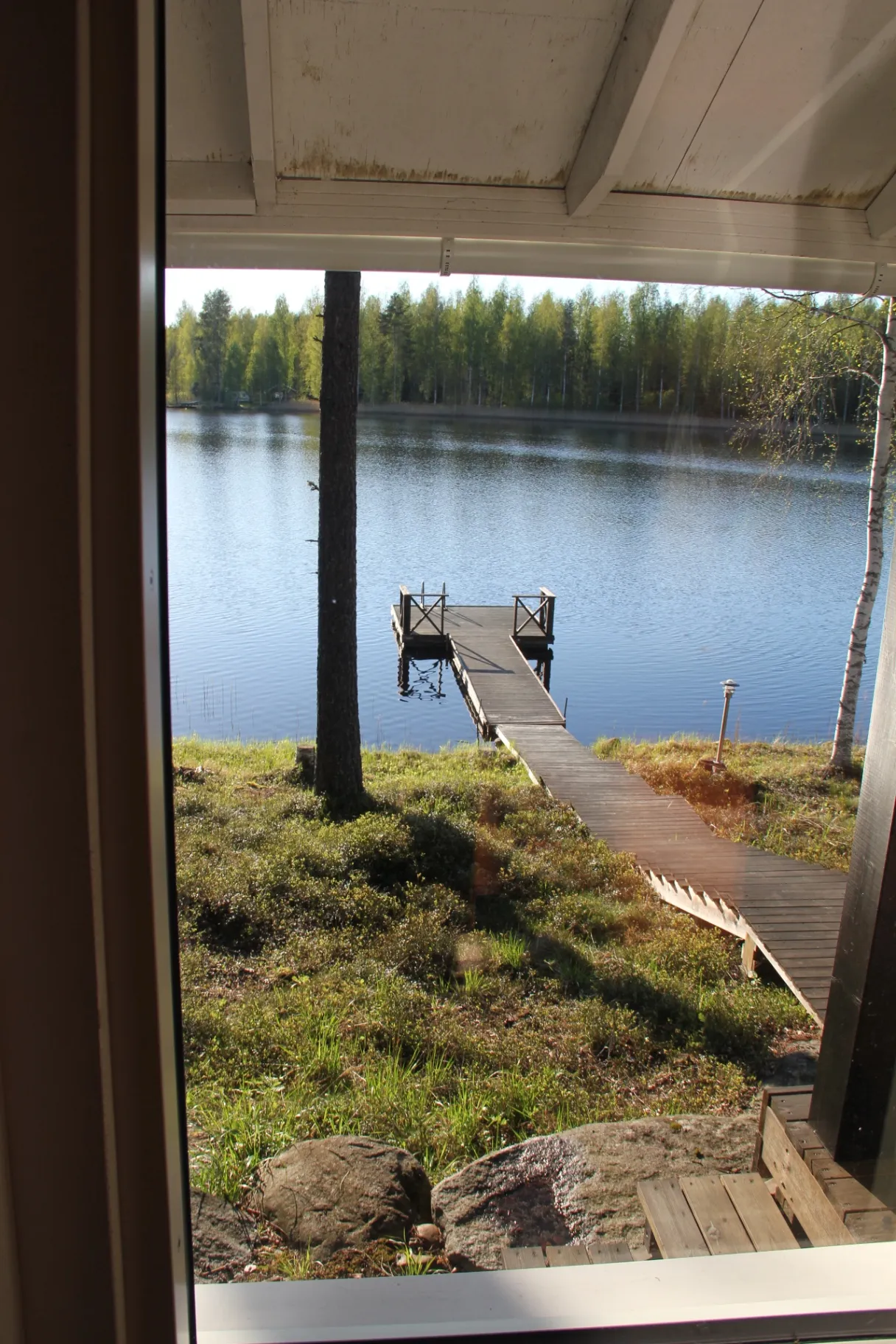 Dock and lake seen through the sauna window